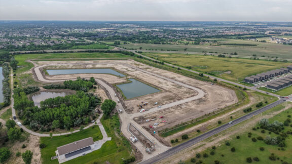 Photo from drone of Addis Woods construction progress. Streets and lots are leveled.